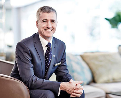 CEO of the company, Craig, sitting in a business suit, looking attentive to customer's needs